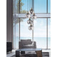 Cedro Glas-Pendelleuchte 5-flg. Bronze, Schwarz im eleganten Wohnzimmer mit großen Fenstern und Meerblick.