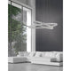 Celine LED Kristall-Hängeleuchte Glas Chrom über modernem Wohnzimmer mit großer Fensterfront