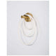 Cerelia LED Wandlampe Silikon in modernem Design mit Messing Gold Oberfläche und Silikonkabel.