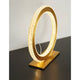 Cilion LED Tischlampe Ø 25cm Messing, Gold auf schwarzem Tisch mit modernem Design