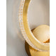Cilion LED Wandlampe Messing, Gold mit kristallinierter Oberfläche und elegantem Design.
