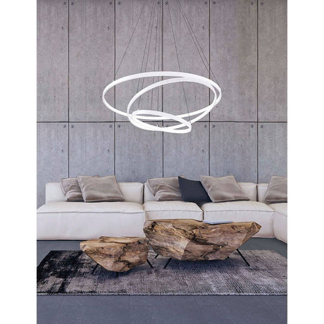 Dea LED pendellampe hvit over moderne stue med sofa og salongbord.