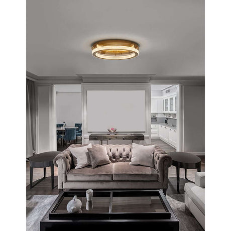 Fiore LED ceiling lamp in antique gold in an elegant living space above a comfortable sofa.