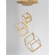 Gabbia LED Hängelampe 3 Würfel in modernem Design mit goldenen und transparenten Elementen.