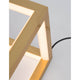 Gabbia LED Würfel Tischlampe mit edler goldener Oberfläche und beleuchtetem Rahmen.