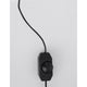 Gabbia LED Würfel Tischlampe mit schwarzem Dimmer und Kabel an einer Wand.