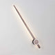 Kedo LED Wandleuchte aus Aluminium an einer Wand montiert, modernes Design mit sanfter Beleuchtung.