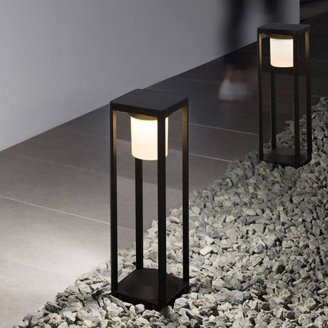 Loveto bollard solar light with motion sensor in a modern design on a gravel path
