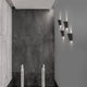 Miley Mini LED-Wandleuchte up&down IP54 an einer modernen Wand mit schlichten, eleganten Linien.