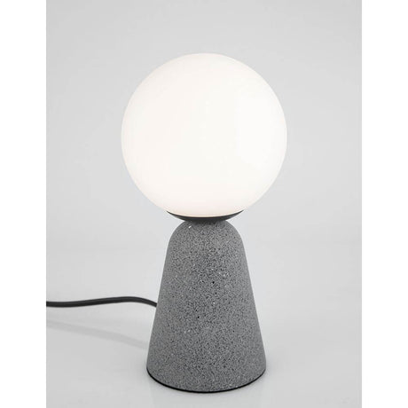 Orion table lamp in concrete with a white opal dome on a grey concrete lamp base.