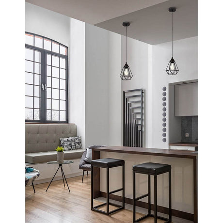 Modern interior with Paolo pendant lamp metal black above a bar and stylish decor.