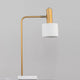 Moderne Paz Skandi Tischleuchte in Goldfarben-Matt mit weißem Lampenschirm für nordisches Wohndesign.