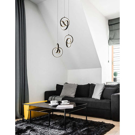 Rings LED pendant light suspension black in a modern living space above a black-and-white table.