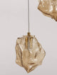 Odelle Pendelleuchte 3-flammig Ø 40cm Gold, Bernstein in mundgeblasenem Glas, elegant und stimmungsvoll.