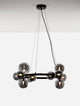 Odillia Pendelleuchte Ø 65cm G9 11-flammig mit elegantem Design aus opalinem Glas und Goldmetall.