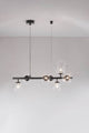 Odillia Pendelleuchte G9 7-flammig in modernem Design mit Opalglas und Metalloberfläche.