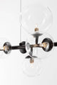 Odillia Pendelleuchte G9 7-flammig mit elegantem Spiel von Opalgläsern und mattgoldener Metalloberfläche.