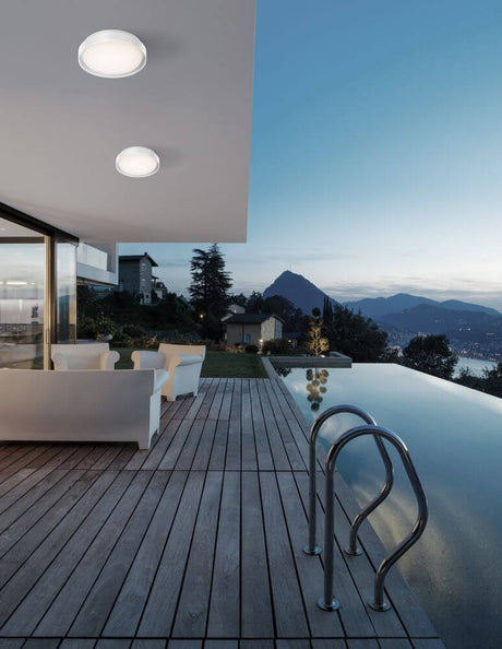 Oliver LED outdoor wall light 3000K IP65 on a modern terrace canopy with pool and mountain view