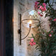 Oluce Kugelglas Außen-Wandlampe Lyndon Schwarz, stilvolle Wandbeleuchtung mit Glas und Metall für Außenbereiche.