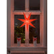 Oranger Papierstern perforiert orange bestickt 7 Zacken ohne Leuchtmittel, dekorativ im Fenster beleuchtet.