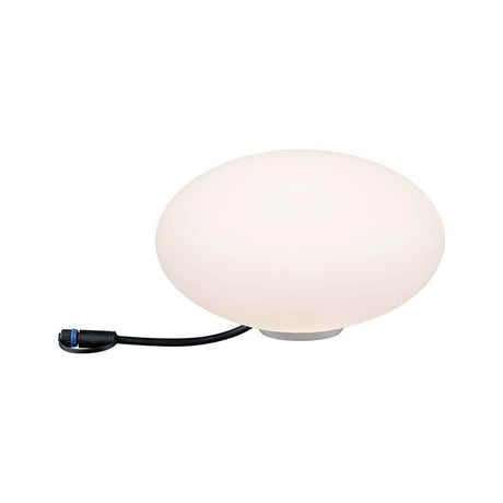 LED Plug & Shine Lichtobjekt Stein Ø 28cm IP67 24V 3000K 235lm auf einem Tisch, warmweißes Licht, dekorativ.
