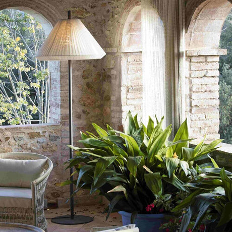 Outdoor pole for Hue Structure (without shade) IP65 stands next to plants in a sunlit room.