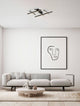 Pace LED Deckenleuchte 58cm 5-flammig 3000K Weiß in modernem Wohnraum mit Sofa und Kunstwerk an der Wand.