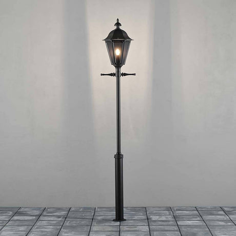 Pallas bollard light 260 cm black, smoky acrylic glass on a stone floor.