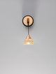 Paluz LED Wandleuchte 3000K Schwarz, Roségold an einer Wand montiert mit eleganter Glas- und Metallkombination.