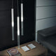 Panzeri Candle LED-Pendelleuchte Glaszylinder im modernen Wohnraum mit Diffusoren und stilvollem Ambiente.
