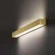 Panzeri Toy LED Wandleuchte Up&Down 60cm in elegantem goldfarbenem Design an der Wand.