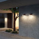 Panzeri Venexia LED-Außenwandleuchte IP65 an einer modernen Hauswand in elegantem Grauton.