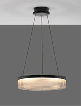 Pauline LED Pendelleuchte in Schwarz mit transparentem Glas, ultraflaches Design und sanfter Lichtdiffusion.