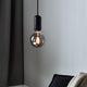Pendelleuchte Notti E27 Schwarz mit harmonischer Form und organischem Design, ideal für moderne Inneneinrichtungen.