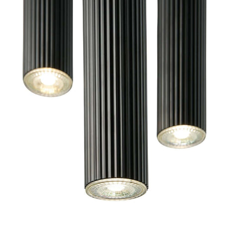 Vico 3-Rondel pendant light with a ribbed surface and downward-directed light.