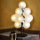 Pulpo LED Tischlampe Stellar Grape in Schwarz mit 13 mattierten Glaskugeln, elegante Beleuchtung für jedes Interieur.