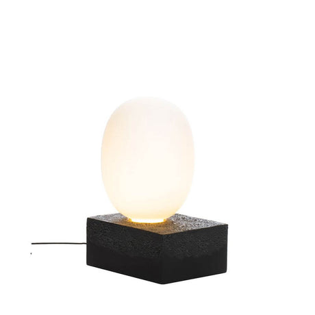 Pulpo LED table lamp Magma Two High Ø 30cm H 55cm on a black ceramic base with soft light.