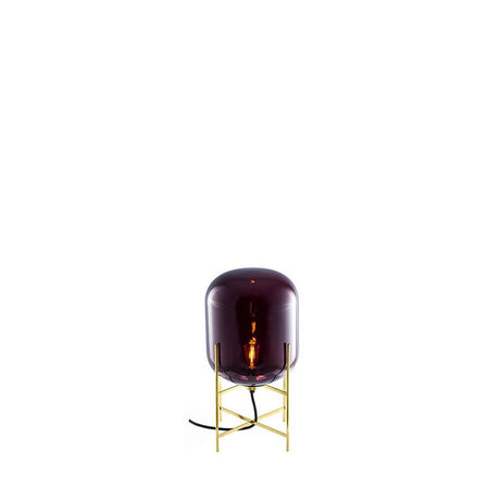 Pulpo LED table lamp Oda Small Ø 24cm H 45cm in purple glass with a gold base.