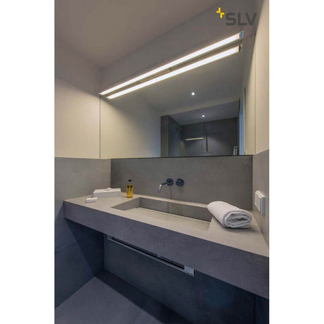 Q-Line LED wall light White 3000K in a modern bathroom with washbasin and large mirror.