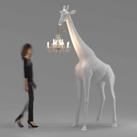 Giraffe in Love M floor lamp 265 cm with chandelier, handmade, modern design, standing next to a person.