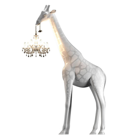 Giraffe in Love floor lamp 400 cm life-size with a chandelier in its mouth, playful design.