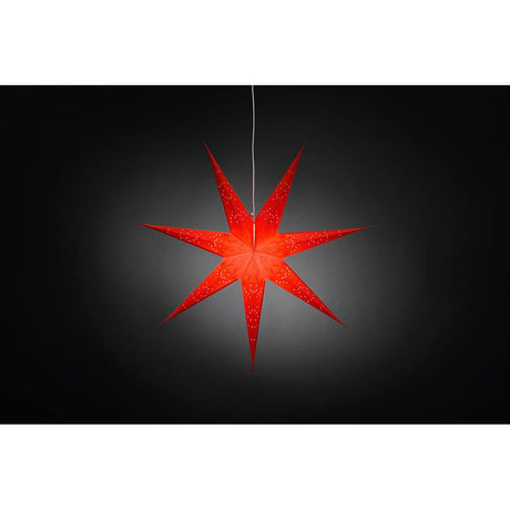 Roter Papierstern perforiert und rot bestickt 7 Zacken ohne Leuchtmittel, hängend vor dunklem Hintergrund.
