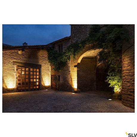 Dasar 270 3000K Round Asymmetrical IP67 in a beautifully lit outdoor area.