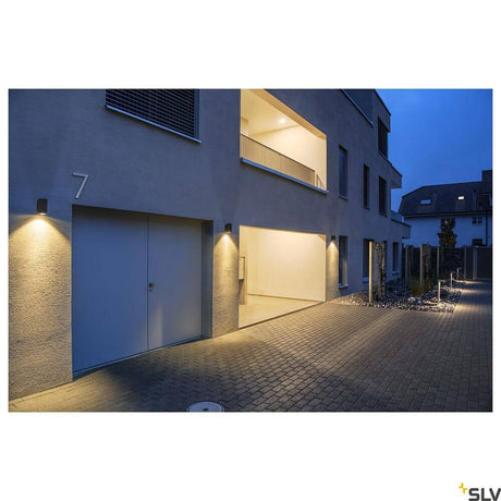 Enola LED wall surface-mounted light Square IP65 anthracite installed on a modern building at dusk.