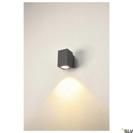 Enola LED wall surface-mounted light Square IP65 anthracite mounted on a wall with light beam