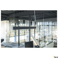 Glenos 1M Pendellampe Schwarz 4000K in modernem Büro mit Glaswänden und stilvollem Interieur.
