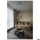 Helia Ambient 35 LED Pendelleuchte Schwarz ohne Baldachin im modernen Wohnzimmer über Sofa und Couchtischen.