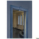 LED Wand- & Deckenaufbauleuchte Out-Beam Frame IP55 im Eingangsbereich mit Stuhl und modernen Designelementen.
