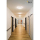 Lipsy 40 Dome LED Außen-Aufbauleuchte Weiß IP44 in einem hellen Flur installiert.