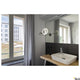 Moderne Badlampe MAGANDA WL mit Schminkspiegel und CCT-Funktion in stilvollem Badezimmer.